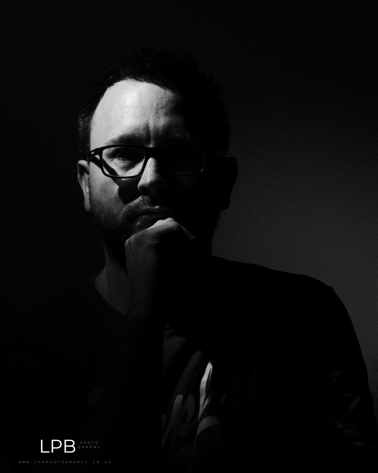 Black and white self portrait of the photographer in natural light